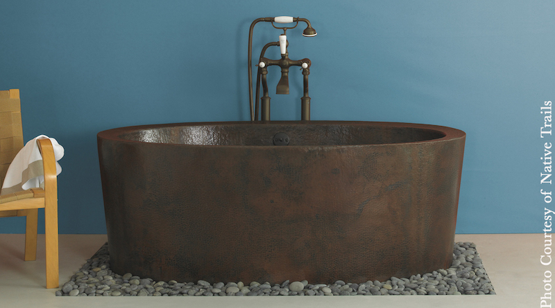 copper tub in blue bathroom remodel