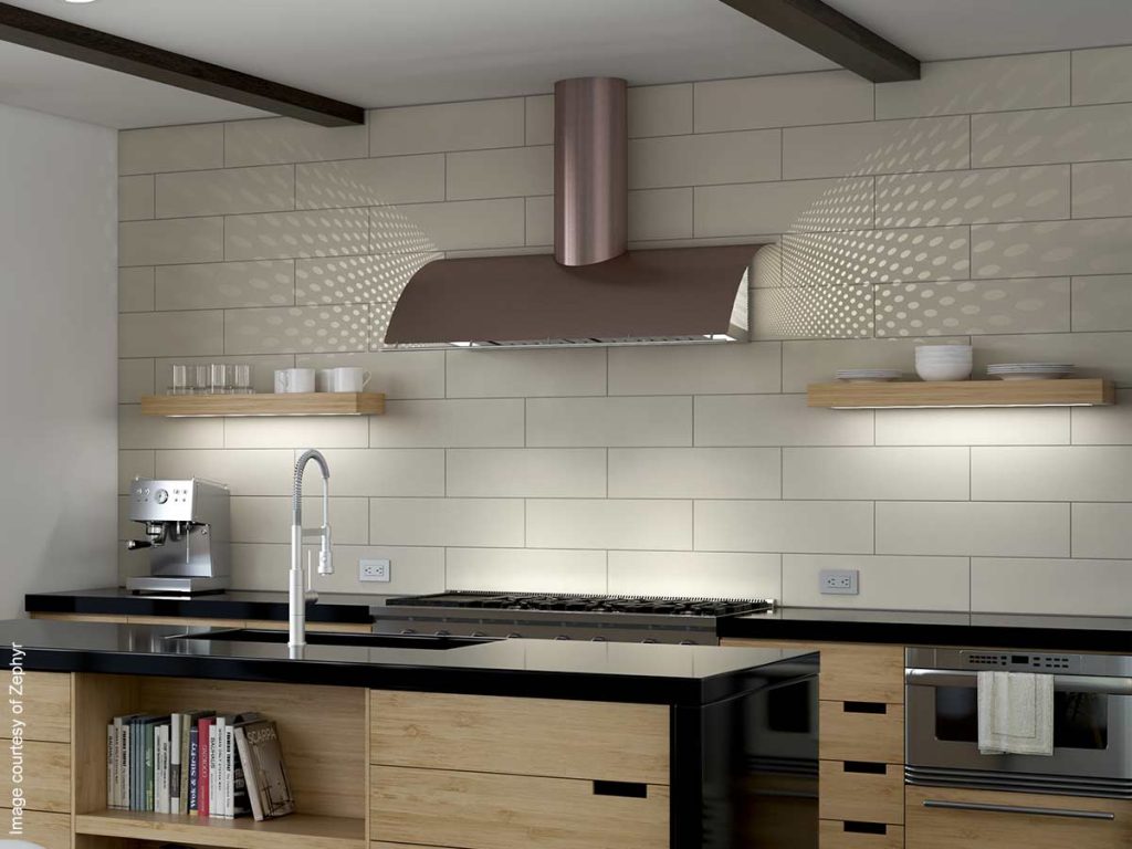 Decorative range hood in rose gold makes a statement in this updated kitchen