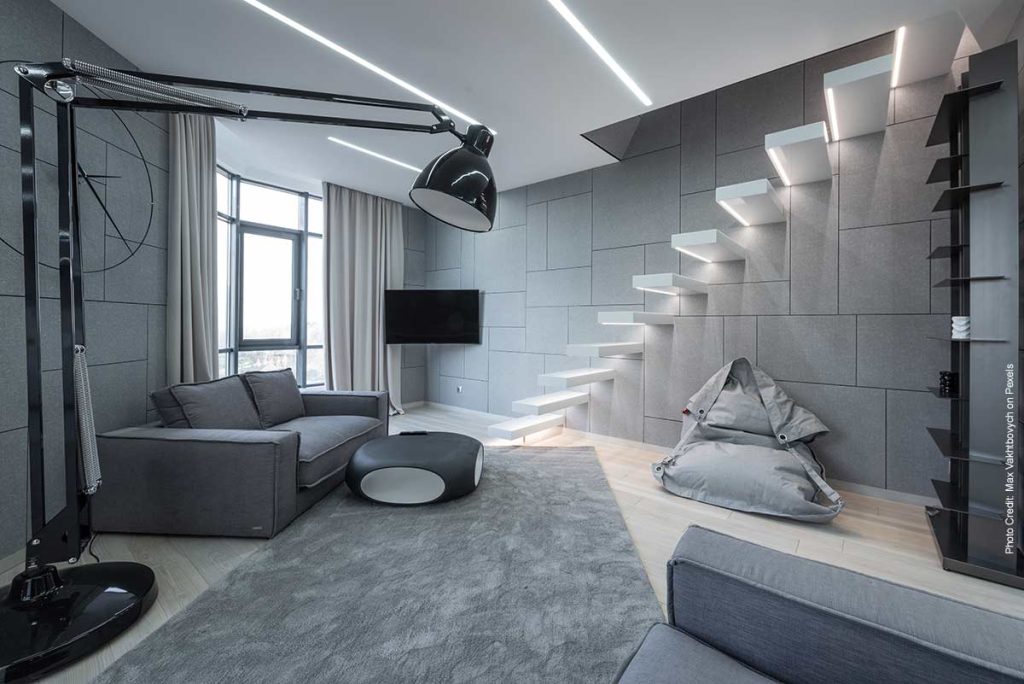 Solid white stairs protruding from wall to create a floating- style staricase
