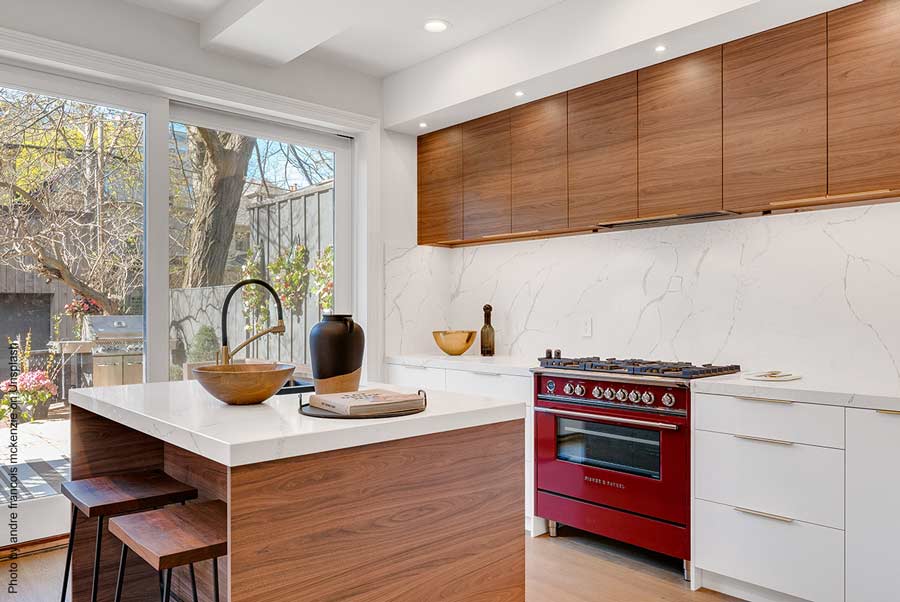 Small but high-end kitchen with island and red stove