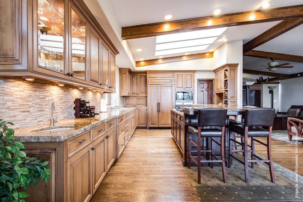 Luxury kitchen with long counter and wood kitchen cabinets