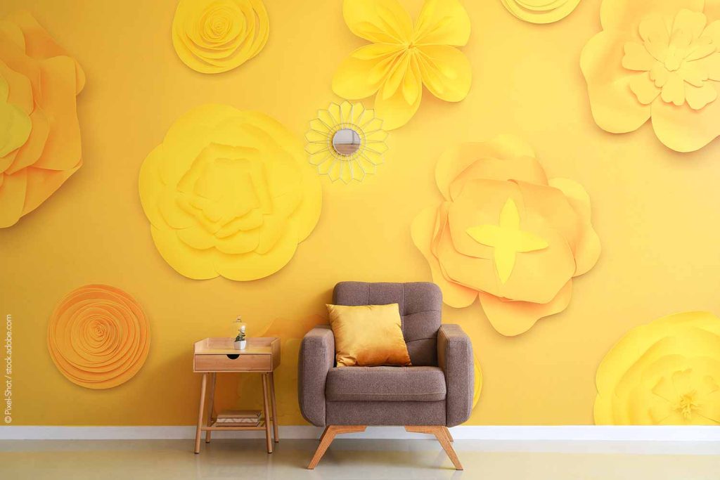 Wall murals, like this yellow flower mural, are the next home design trend