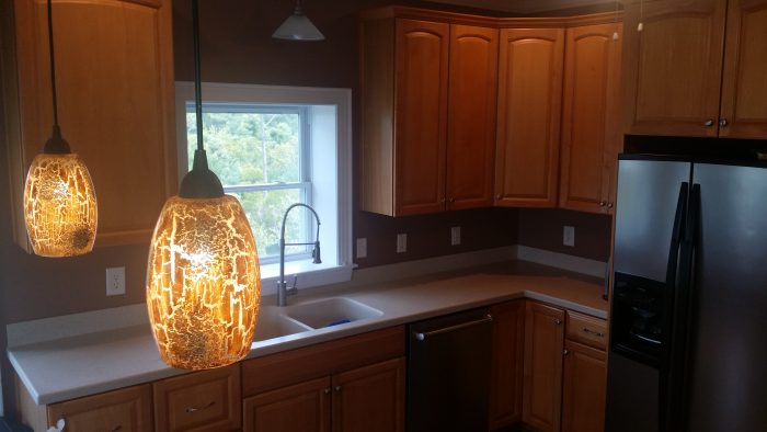Kitchen remodeled with elegant pendant lights